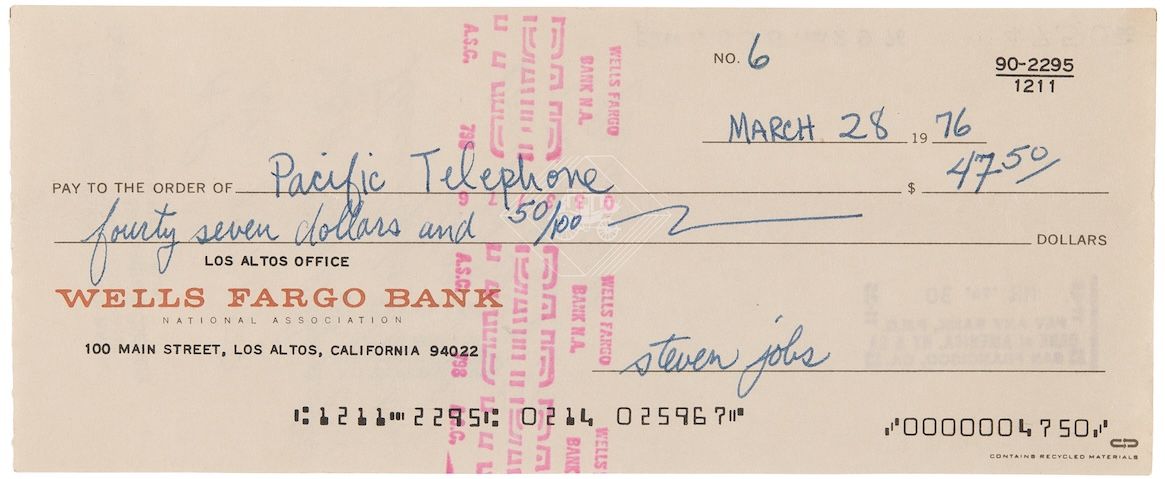 Unlike other similar checks, this example lists Jobs, Wozniak and Wayne’s name on the back. (Credit: RR Auction)