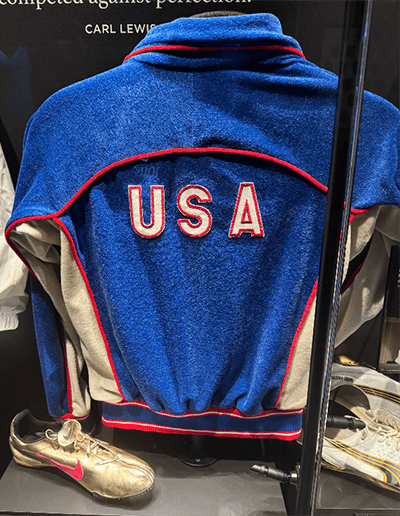 Carl Lewis' Team USA warm-up jacket is part of the Olympic exhibit. (cllct photo by Darren Rovell)
