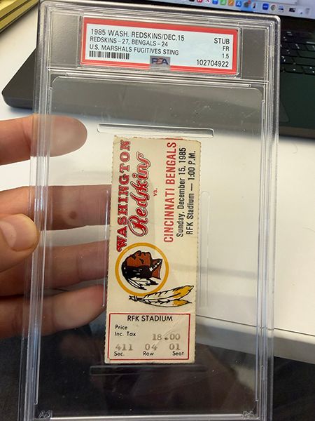 The author holds a PSA-graded ticket to the Operation Flagship game. (cllct photo by Darren Rovell)